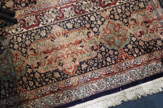 A Kashmir blue ground silk on cotton carpet, 13ft 8in by 8ft 10in.